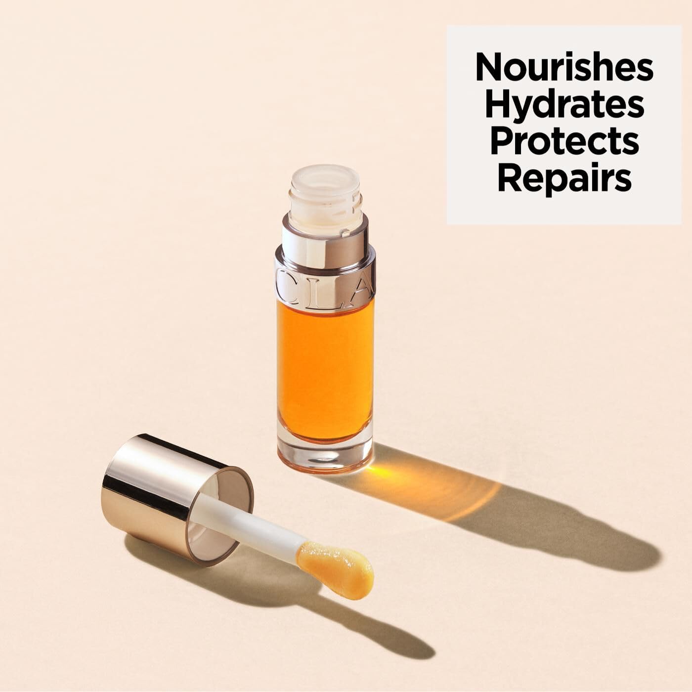Clarins Lip Comfort Oil 7ml| Hydrating, Nourishing and Moisturising Lip Oil | Sheer, High Shine Finish | Soothes, Comforts and Protects Lips | Visibly Plumps | 93% Natural Ingredients